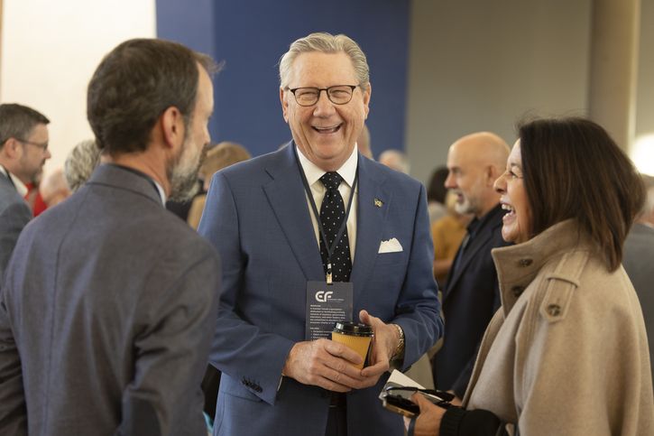 President Schmid (center) speaks with Economic Forum of Albuquerque attendees, including María Griego-Raby (right), former Deputy Chair of the Kansas City Board of Directors.