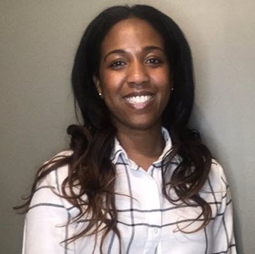 Alexandria Caldwell of the Kansas City Fed smiling at the camera