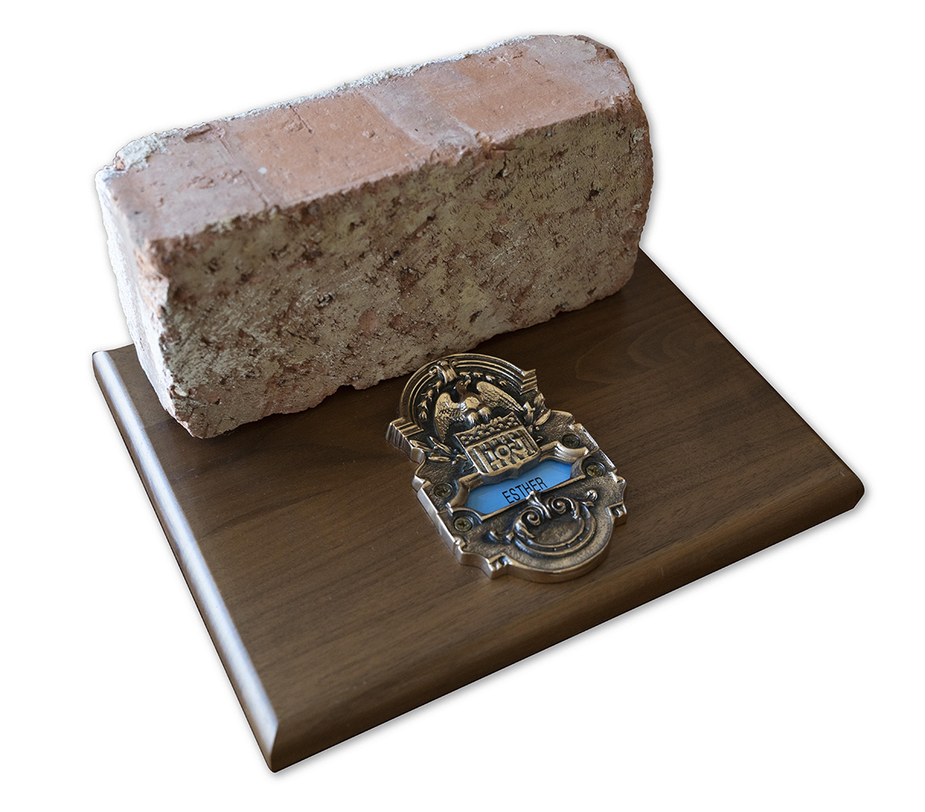 A red brick and a brass doorplate from the Kansas City Fed's former headquarters at 925 Grand in Kansas City.