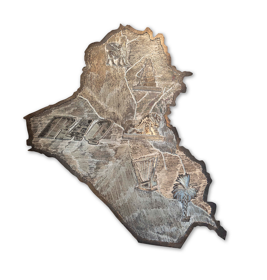A metal engraving of the country of Iraq