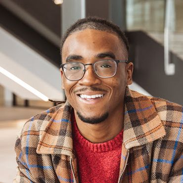 Posed photo of DeAndre Martin, a young Black man.