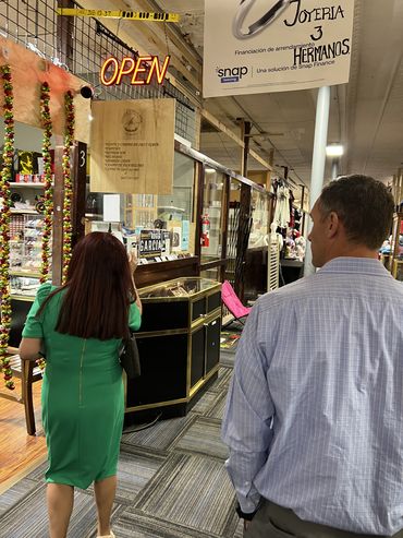 Photo of Nebraska Hispanic Chamber of Commerce President Yesenia Peck and Omaha Branch Executive Nate Kauffman on their way to Joyeria 3 Hermanos, a jewelry store in South Omaha.