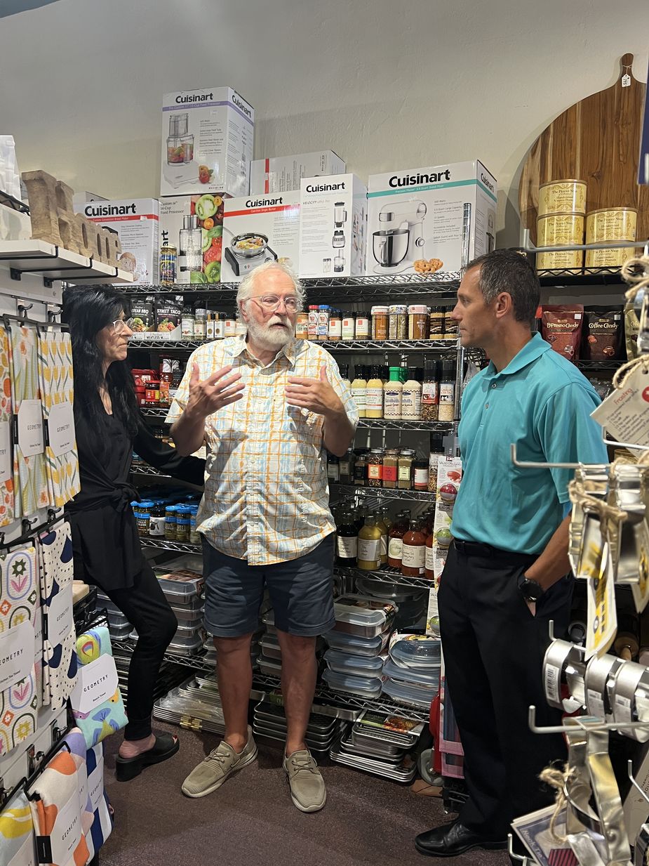 Nate Kauffman speaks with the owners of Knowlen-Yates in McCook.