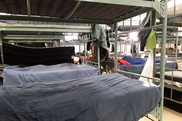 Photo of bunk beds inside a shelter serving homeless people.