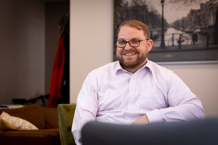 Steven Howland of the Kansas City Fed sitting in a chair