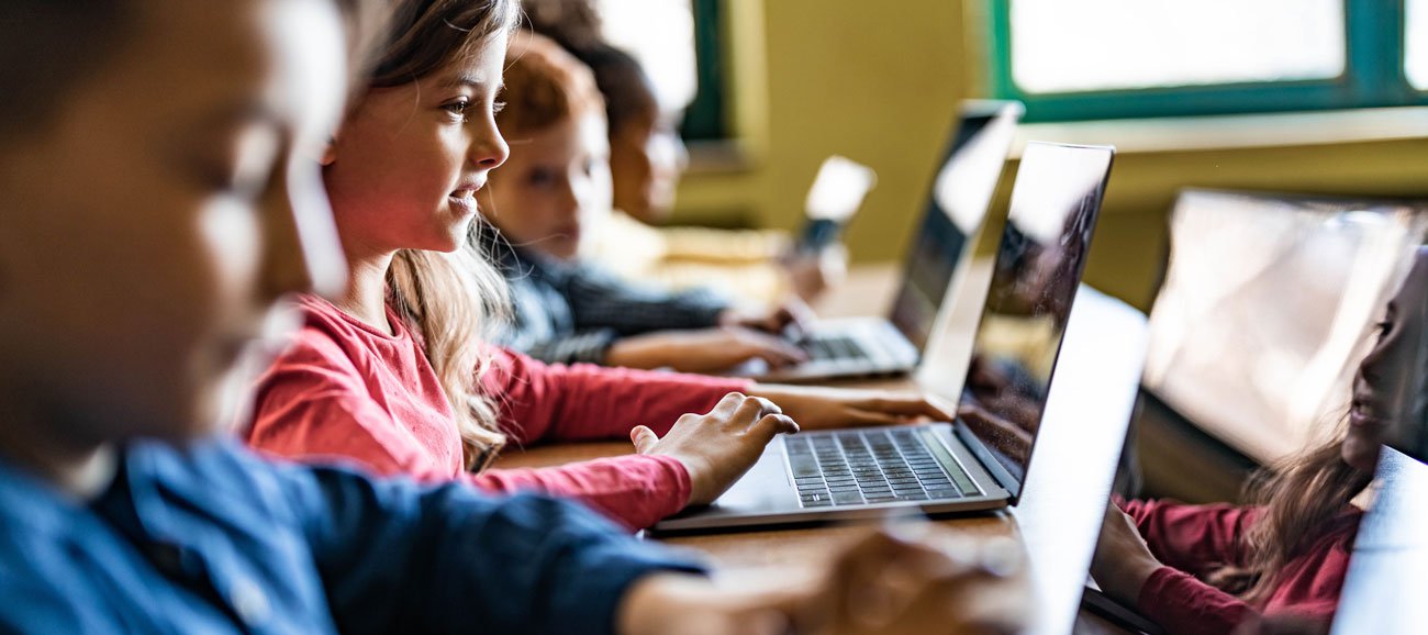 collection of Federal Reserve educational resources including digital publications and interactive apps on multiple devices
