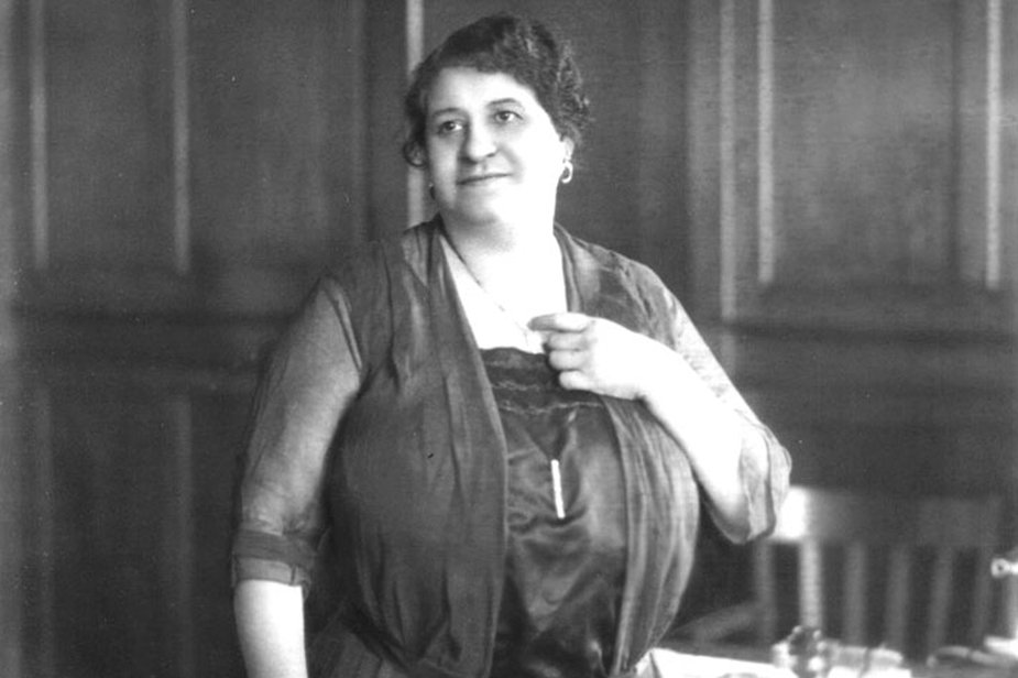 Image Description. Black and white photograph of Maggie Lena Walker shows a woman of color, smiling.