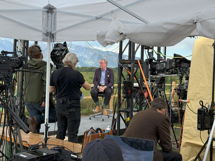 Kansas City Fed President Jeff Schmid prepares for a television interview.