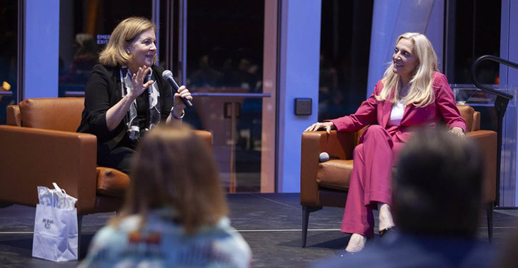 Kansas City Fed president Esther George sitting on stage next to Federal Reserve Governor Lael Brainard at the First Americans Museum.