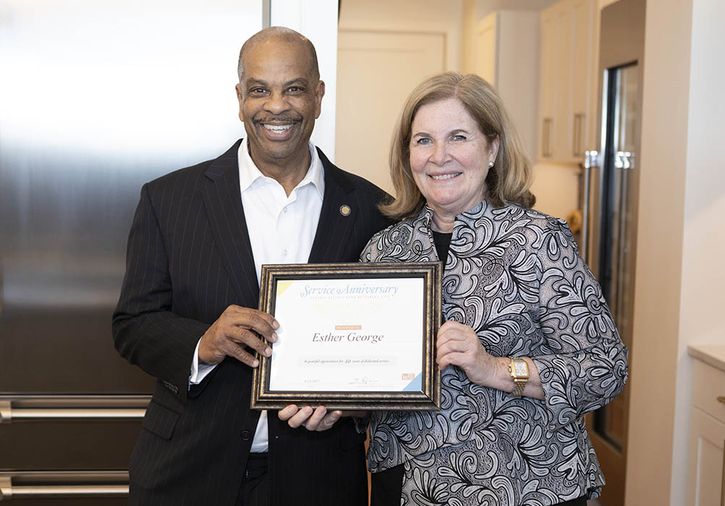Kansas City Board Chair Edmond Johnson presented President George’s 40-year Reserve Bank service certificate.